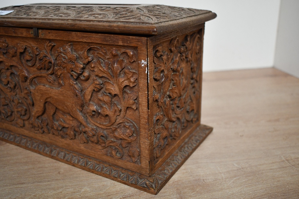 A small 20th-century carved wooden tissue box holder, in the form of a chest, featuring detailed - Image 4 of 5