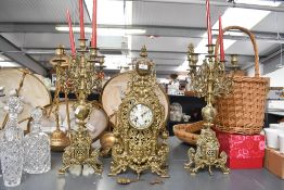 A 20th-century Walt ornate brass three piece clock garniture, featuring a central striking mantel