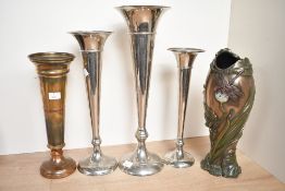A quantity of early 20th-century metal trumpet bud vases, to feature a set of three graduated