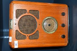 A vintage Bush R701 FM/MW analogue radio with a wooden case, marked to front plaque, 34cm x 24.