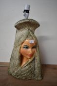A mid 20th-century kitsch Vladimir Tretchikoff-style chalkware table lamp, depicting a female in a