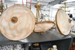 Three large vintage French-style chandeliers, featuring ornate gilt metal frames and large marbled