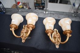 Two vintage ornate double-headed metal wall sconces, having marbled glass shades, unmarked, wall