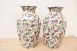Two 20th-century Crown Ducal-style porcelain vases, featuring colourful floral and grape decoration,