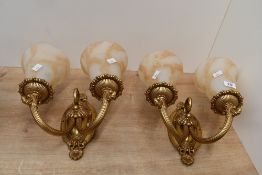 Two vintage ornate double-headed metal wall sconces, having marbled glass shades, unmarked, wall
