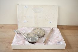 A mid to late 20th-century Anais Anais Cacheral silver-plated vanity dressing table set, featuring