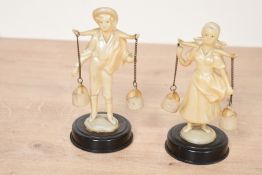Two vintage Italian-style ivory-coloured plastic figurines, depicting a young country boy and