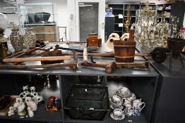 A selection of late 19th to early 20th-century wood and metal agricultural tools, to feature a large