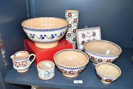 A selection of 20th-century Irish Nicolas Mosse Pottery, to feature three graduated 'Old Rose'