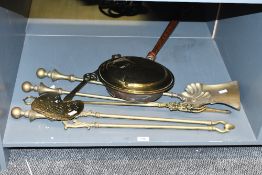 A quantity of early 20th-century brass fireside companion wares, to feature tongs, shovel and