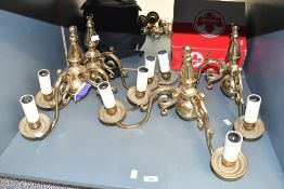 Four vintage Chelsom Flemish-style brass double wall lights, featuring swirled scrolled arms and