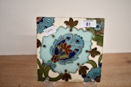 A late 19th-century to early 20th-century Arts and Crafts pottery tile in the style of William De