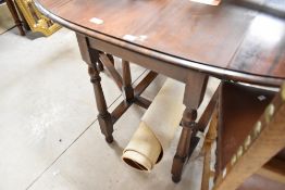 A mid 20th Century mahogany gateleg table having oval top