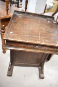 A Victorian pine school desk, in a dark stain, dimensions approx. Width 60cm, height 85cm