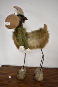 A modern decorative reindeer , having faux fur skin and feet
