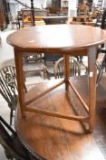A 19th Century painted cricket table of small proportions and typical design, diameter approx. 60cm,