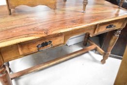 A modern hardwood side table having two frieze drawers and turned frame, dimensions approx. Width