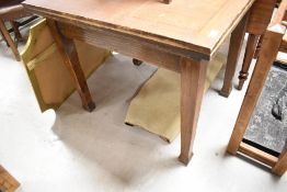 A mid 20th Century oak fold over kitchen table, closed size approx. 76 x 91cm