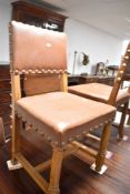 A set of five early 20th Century oak dining chairs having overstuffed leather seats and backs with