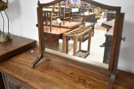 An early 20th Century oak toilet mirror (missing one acorn finial) width approx. 56cm