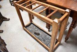 A late Victorian stained frame stick stand with matched metal drip tray, width approx. 91cm