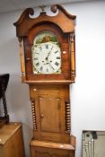 A 19th Century composite wood longcase clock having eight day movement with painted pictorial and