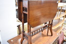 A Victorian mahogany occasional table having bobbin turned supports and turned gateleg, width