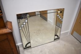 A modern wall mirror, having Art Deco style decoration, approx. 86 x 76cm