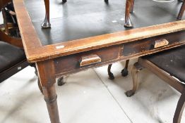 A late 19th or early 20th Century desk/table having skiver top, two short and one long frieze