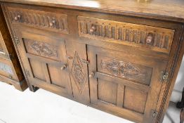 A vintage Oak Old Charm sideboard of typical design , dimensions approx. width 129 height 91 depth