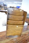 An early to mid 20th Century paper rack, approx height 65cm, width 35cm