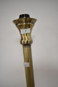A modern brass effect standard lamp