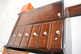 A modern mahogany wardobe/tallboy , probably Stag comprising wardobe section and 6 drawers,