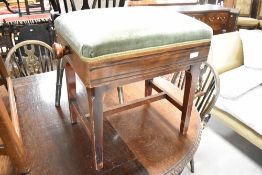 An early 20th Century stained frae adjustable piano stool