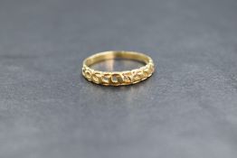 A 14ct gold ring, of a pierced curb chain design, marked 14k, ring size K, 1.2g