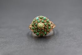 A 9ct gold turquoise triple cluster pave set ring, the small turquoise cabochons being mainly of