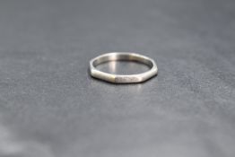 A platinum band, of octagonal form, marked Platinum, ring size N, 2.8g