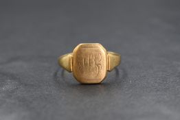 A 9ct gold signet ring, the rectangular panel having a rubbed monogram, marked 375, ring size Q-R,