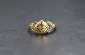 An 18ct gold diamond ring having ten small diamonds in a geometric setting, total approx 0.25ct on