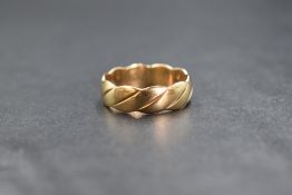 A 9ct gold band, of a rope design, rubbed 375 mark, ring size M-N, 2.9g