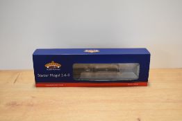 A Bachmann Branch-Line OO gauge model steam locomotive and tender, representing a Stanier Mogul 2-