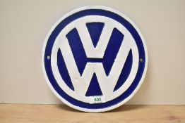 A circular painted cast VW sign 23cm