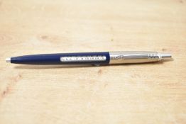 A Parker Jotter ballpoint pen in dark blue with metric converter