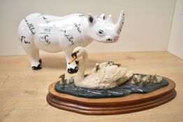A Border Fine Arts orinthological group 'Swan and Cygnets' designed by Ray Ayres sold alongside a
