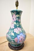 A 20th century Chinese porcelain famille vert style baluster table lamp, decorated with lotus and
