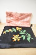 Two 20th century vintage clutch purses or pyjama wallets with padded walls, one black satin with