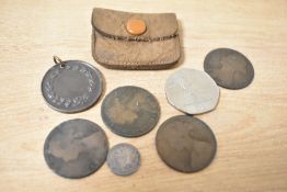 A small selection of coins comprising a George J 1918 silver threepence, 4 Queen Victoria Pennies, a