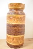 A tall mid-20th-century West German ceramic floor vase, featuring a moulded pattern of flowers,