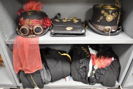 Two sets of 'his and hers' steampunk costumes comprising a top hat, formal jacket and studded