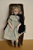 Early 20th Century Bisque Headed Doll having sleep brown eyes, open mouth with four teeth showing,